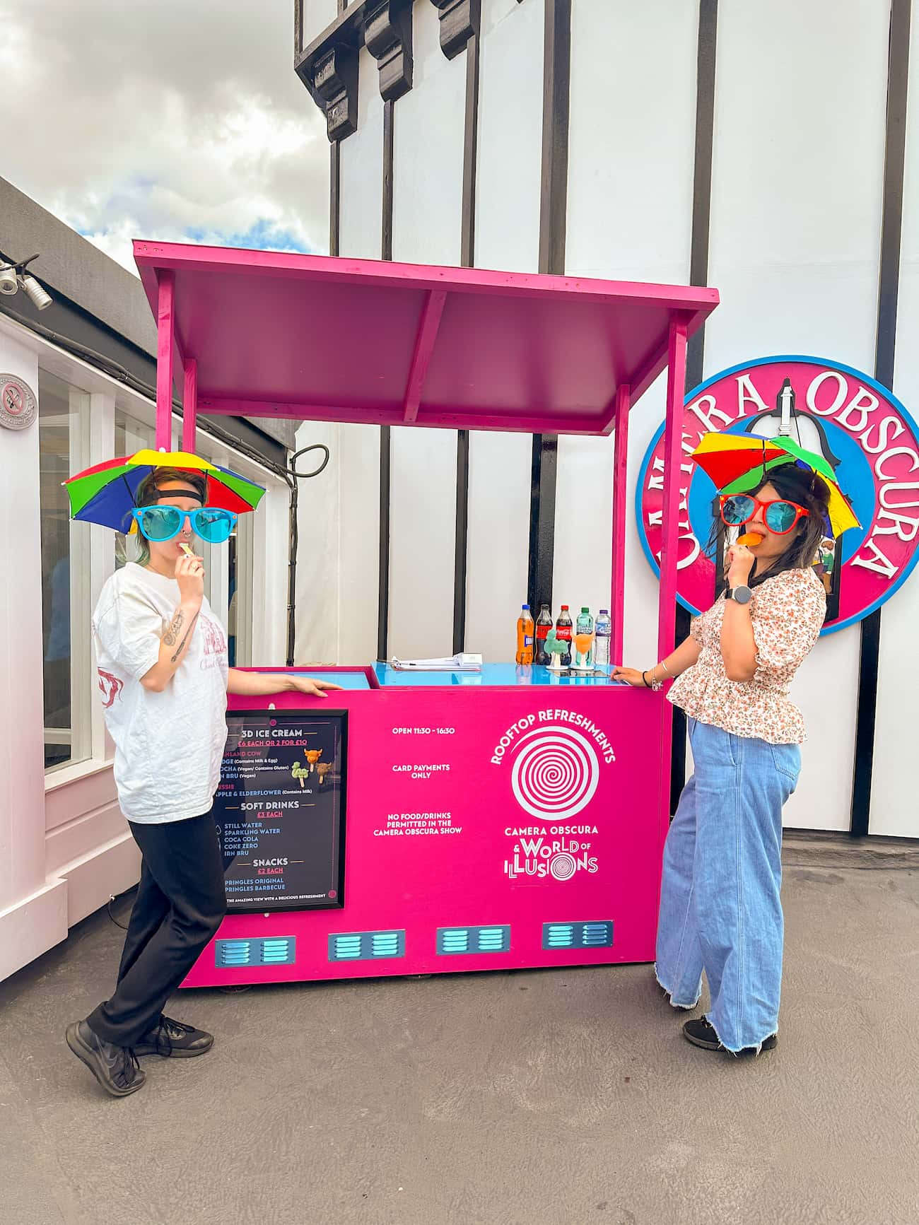 Team members, Hannah and Runkun, eating COOLAB ice cream by the Rooftop Refreshments bar.
