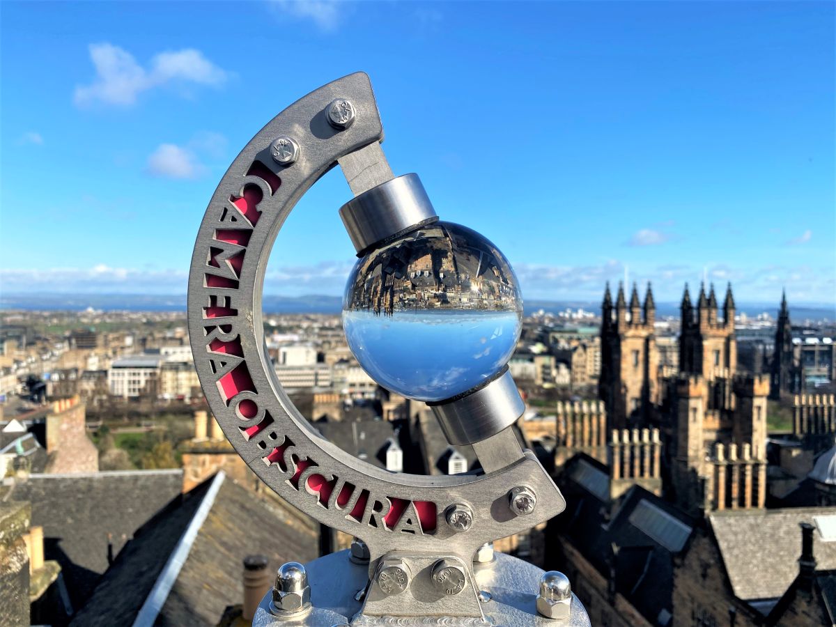 A Glass Globe on the Rooftop at Camera Obscura, reflecting the view of Edinburgh upside down