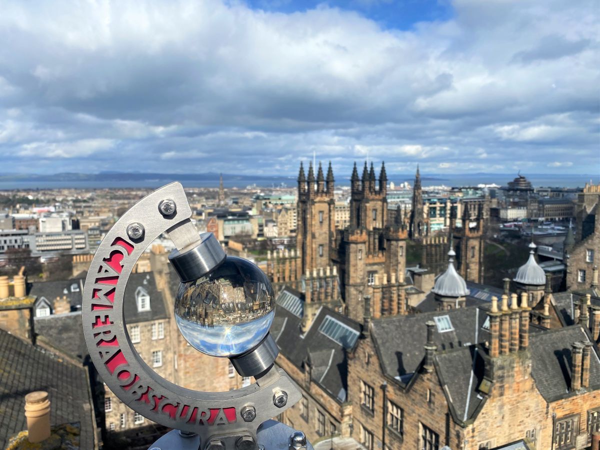 A glass globe on the rooftop at Camera Obscura reflecting the city view