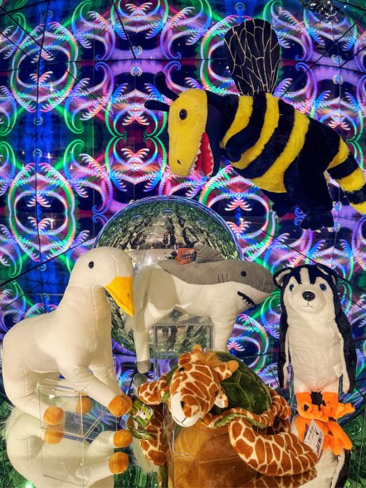 Soft toy animals displayed in a colourful box
