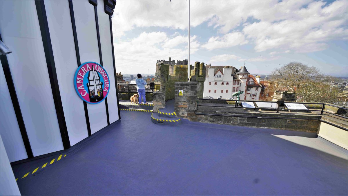The Rooftop Terrace at Camera Obscura with a person and their dog
