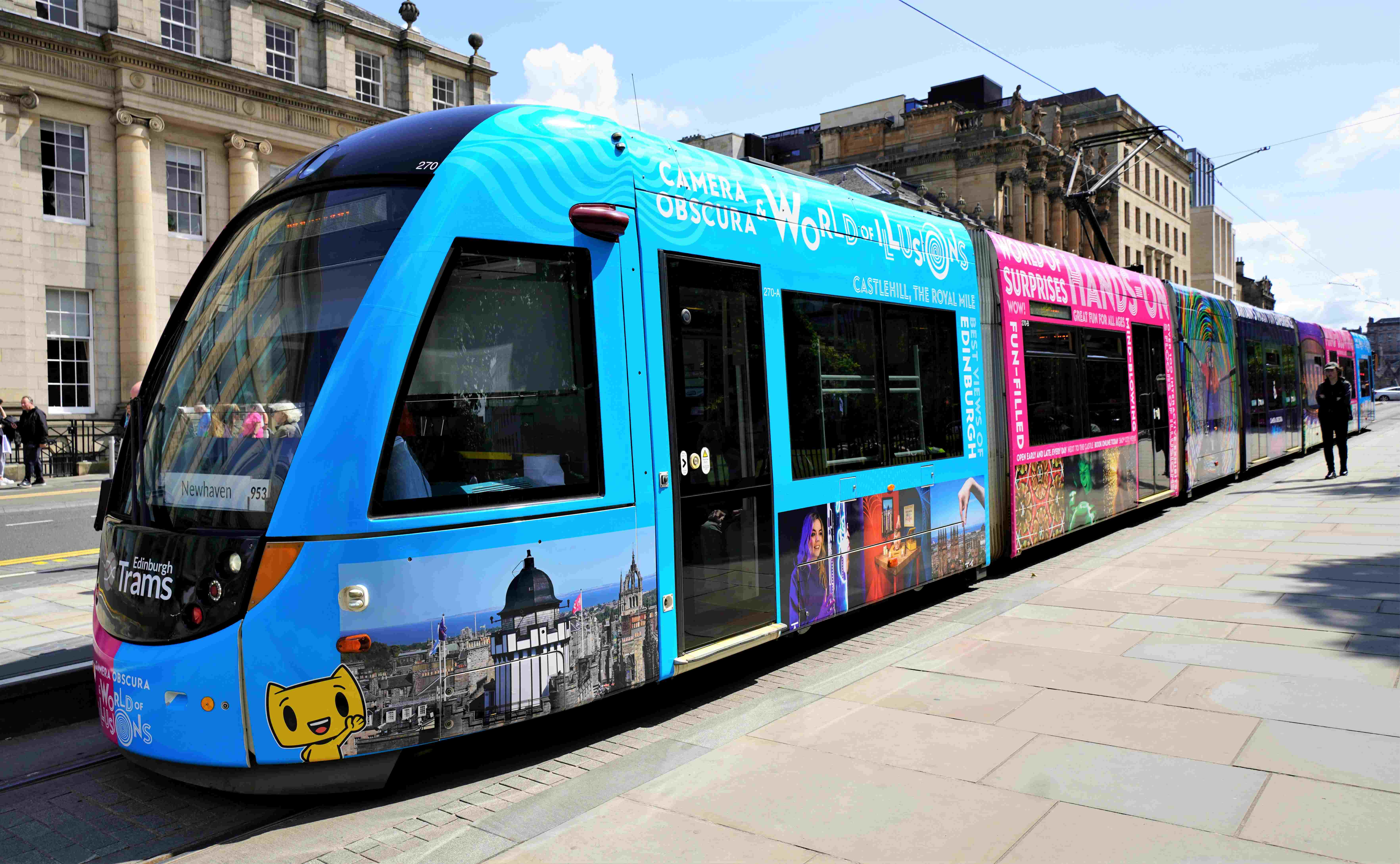 Edinburgh Tram with colourful Camera Obscura images