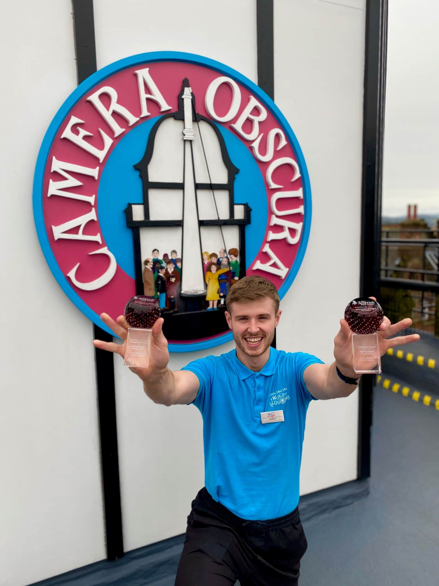Guide Josh holds the two glass Thistle Award trophies