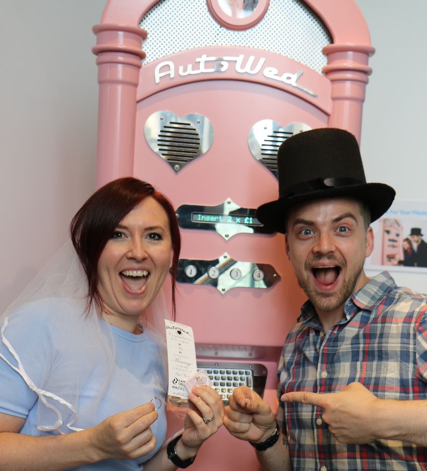 A couple get married at the AutoWed machine at Camera Obscura 
