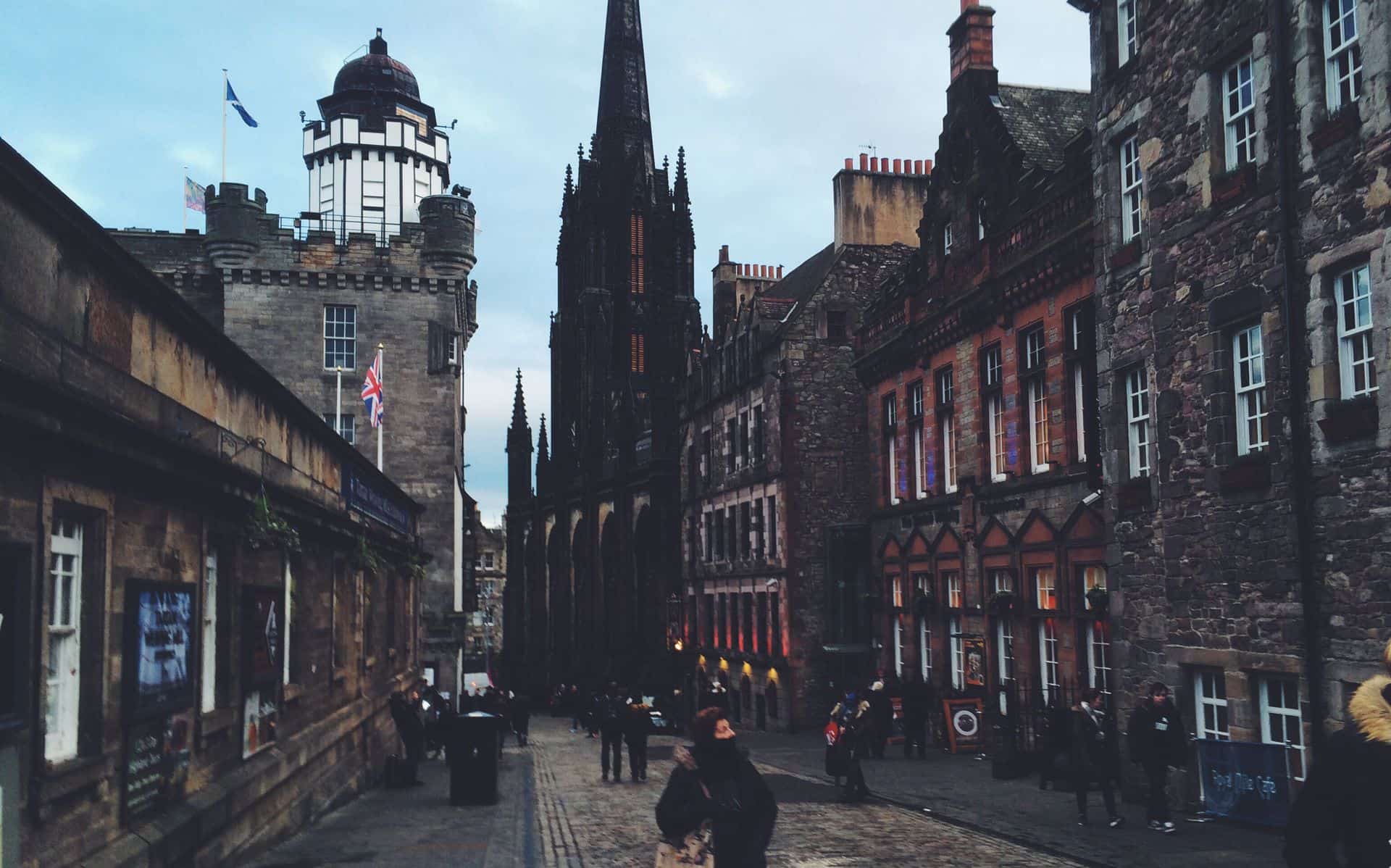 A picture looking down Castlehill Edinburgh with Camera Obscura of the left and Scotch Whiskey Experience on the right