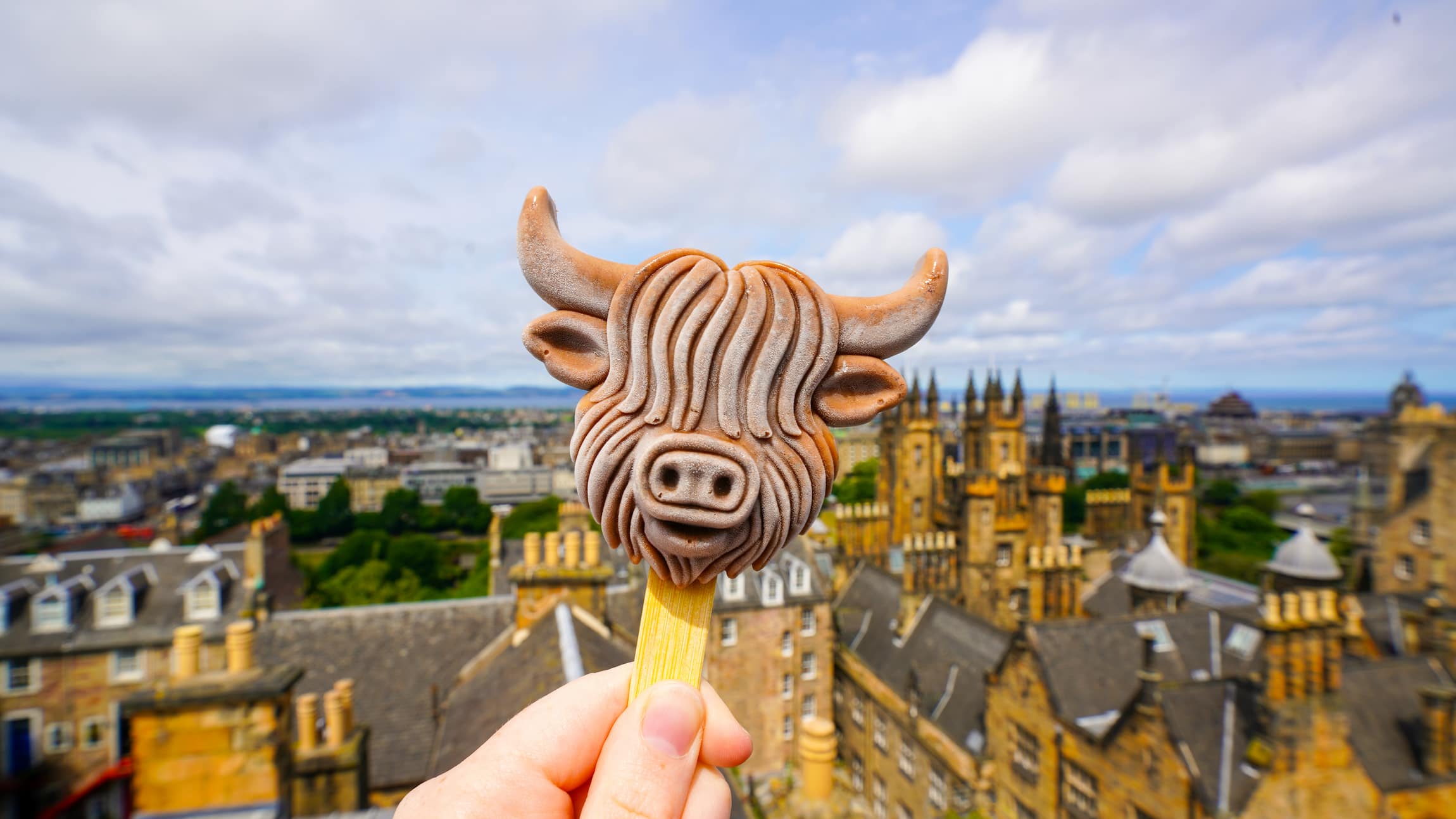 A COOLAB Mocha flavoured 3D ice cream with Edinburgh views in the background.