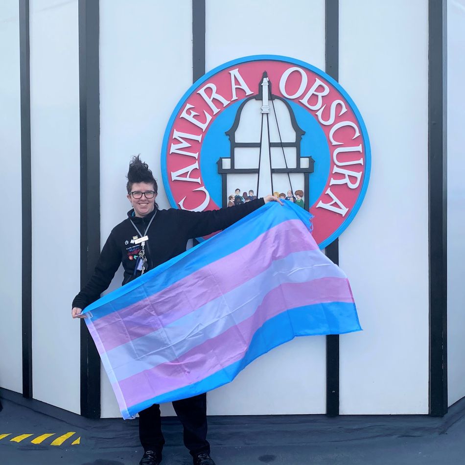 Guide James with the trans pride flag at Camera Obscura Edinburgh
