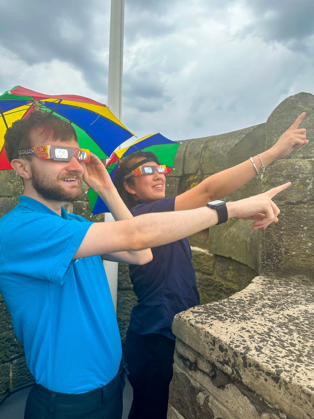 Guides wear solar eclipse glasses on the rooftop at Camera Obscura, Edinburgh