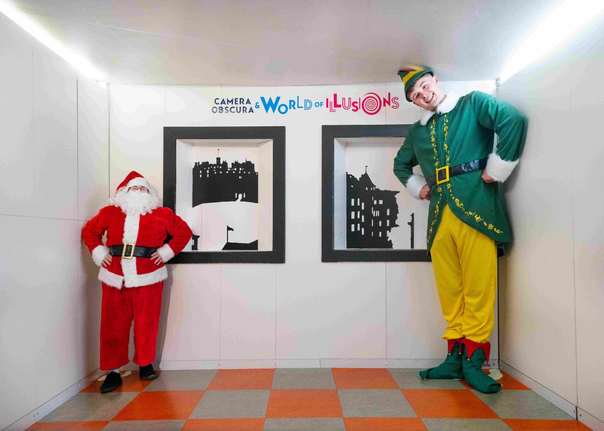 Santa and Elf visit the Ames Room at Camera Obscura in Edinburgh