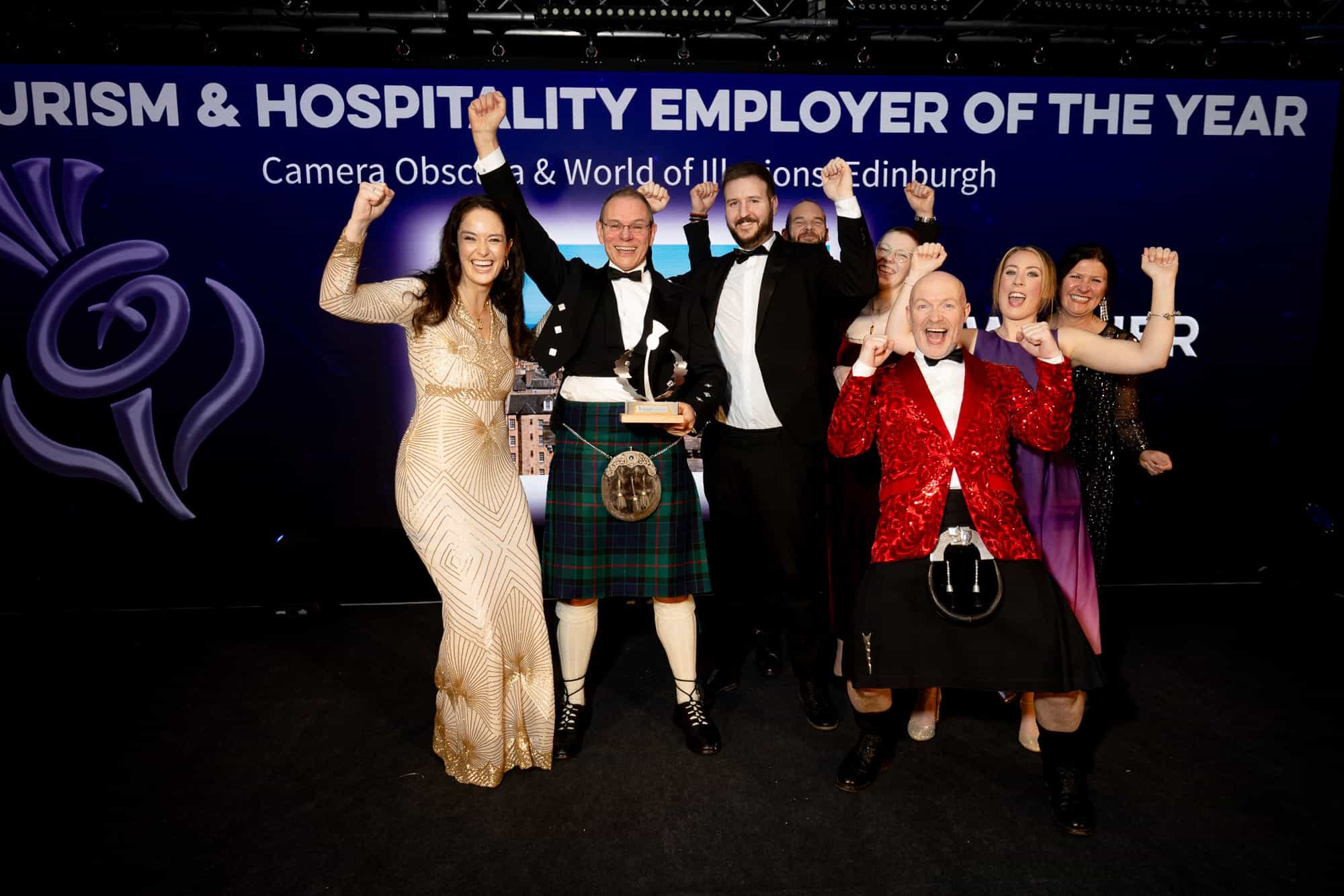 The team accepting the trophy for winning at the National Thistle Award Employer of the Year 2024