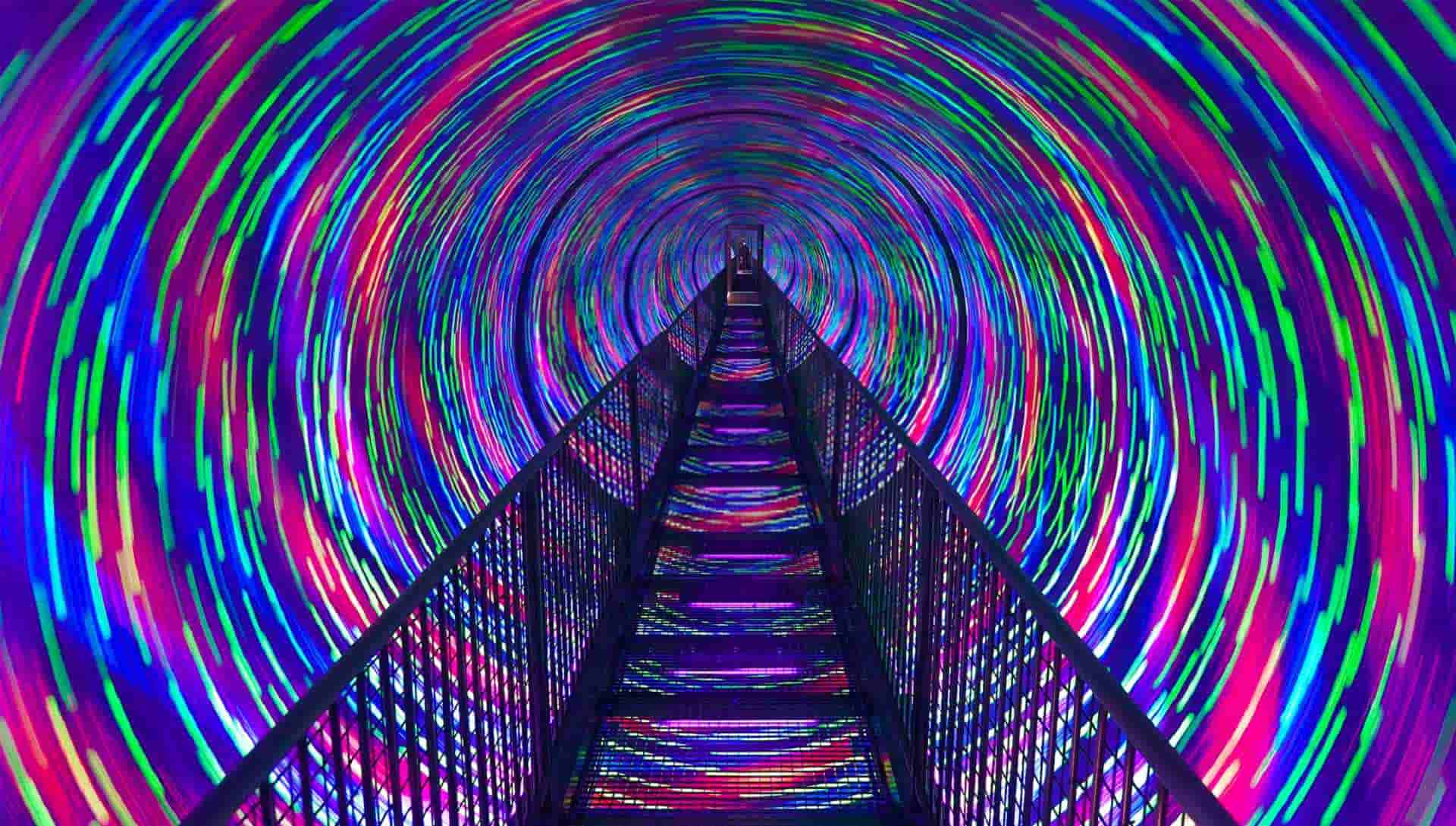 The Vortex Tunnel at Camera Obscura, a long tunnel of coloured lights with a bridge